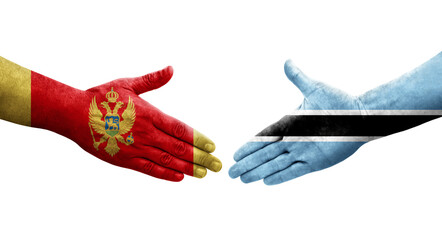 Handshake between Botswana and Montenegro flags painted on hands, isolated transparent image.