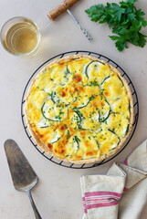 Pie with zucchini, cheese and herbs. Quiche. Vegetarian food. Healthy eating.