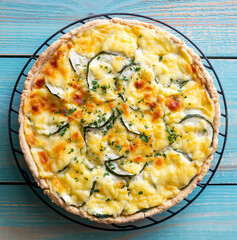 Pie with zucchini, cheese and herbs. Quiche. Vegetarian food. Healthy eating.