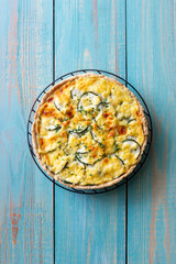 Pie with zucchini, cheese and herbs. Quiche. Vegetarian food. Healthy eating.