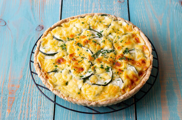 Pie with zucchini, cheese and herbs. Quiche. Vegetarian food. Healthy eating.