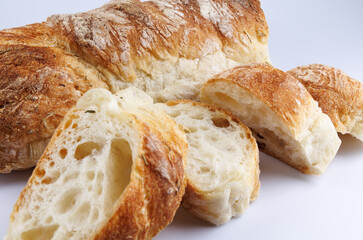 Sliced Swabian baguette isolated on white background. Fresh baguette.