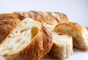 Sliced Swabian baguette isolated on white background. Fresh baguette.