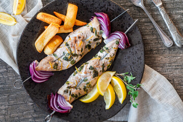 Fish and chips with grilled mackerel kebabs