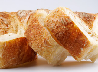 Sliced Swabian baguette isolated on white background. Fresh baguette.