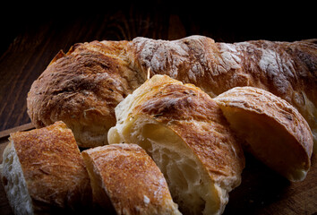 Sliced fresh baguette close-up. Art bread.