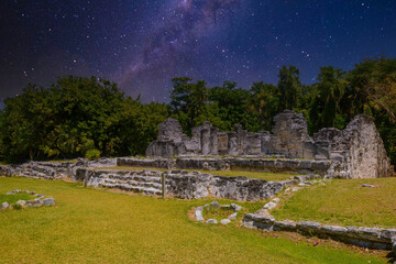 Ancient ruins of Maya in El Rey Archaeological Zone near Cancun, Yukatan, Mexico with Milky Way Galaxy stars night sky