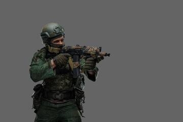 Portrait of military russian man with rifle dressed in modern camouflage uniform.
