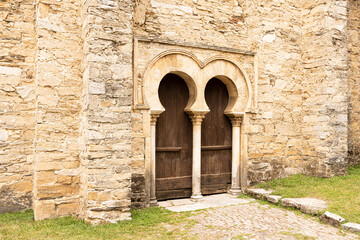 Fototapeta na wymiar Entrance with a door of the mozarabic church
