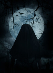 Grim reaper standing over cross, church, crow, birds, dead tree, full moon and cloudy spooky sky,...