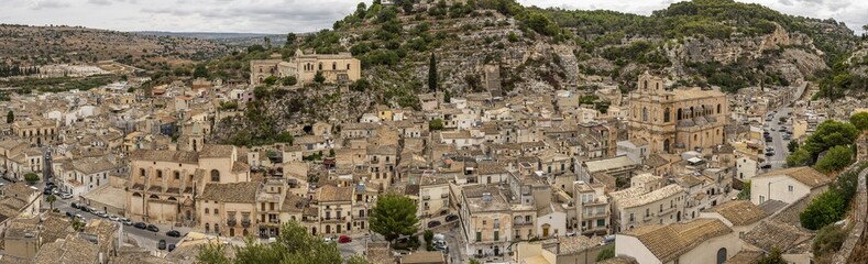 Obraz premium Extra wide aerial landscape of Scicli with beautiful historic buildings in the Baroque style