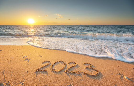 2023 year on the sea shore during sunset.