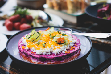 Catering table, beautifully decorated banquet with variety of with different food snacks appetizers on corporate birthday party event or wedding celebration, canape, salad, delicatessen setting
