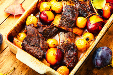 Baked lamb ribs with fruit sauce
