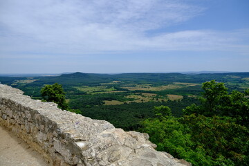 view from castle ruin with hills and fields