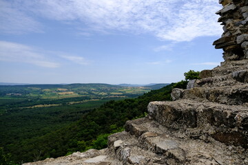 view from castle ruin with hills and fields