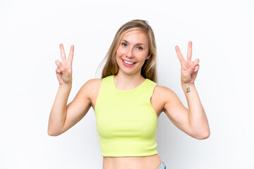 Fototapeta na wymiar Young caucasian woman isolated on white background showing victory sign with both hands