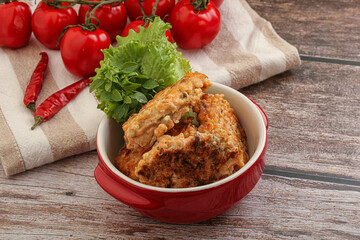 Fried salmonn cutlet in the bowl