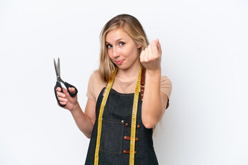 Young blonde seamstress woman isolated on white background making money gesture