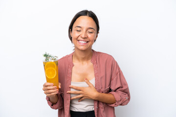 Young hispanic woman holding a cocktail isolated on white background smiling a lot