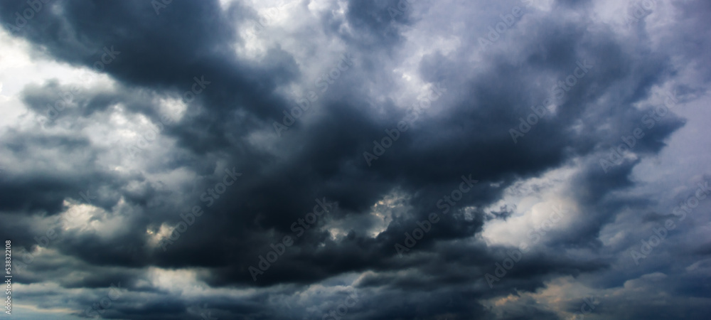 Poster the dark sky with heavy clouds converging and a violent storm before the rain.bad or moody weather s