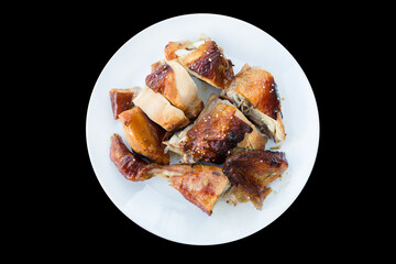 Top view of Roasted chicken isolated on black background, focus selective