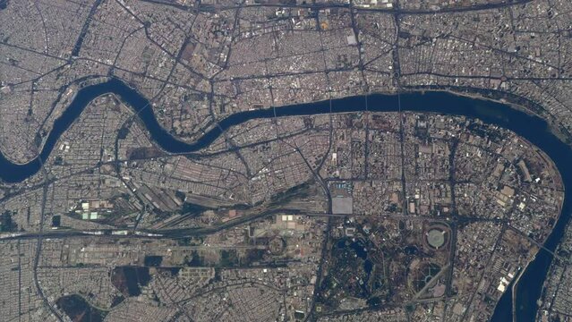 Aerial high altitude plane view of downtown Baghdad also showing the Tigris river it is the capital of Iraq and the second largest city in the Arab world after Cairo 4k resolution animation