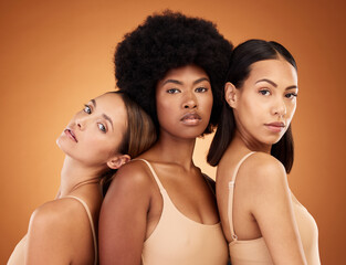 Diversity, skincare and beauty with model woman friends in studio on a brown background for inclusion. Health, luxury and portrait the a female group standing together for wellness or healthy skin