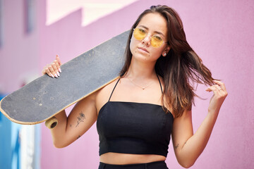 Portrait of woman, sunglasses and skateboard retro look in urban city on street style adventure....