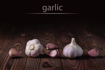 Garlic bulb on wooden background. Close up