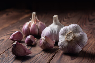 Garlic bulb on wooden background. Close up