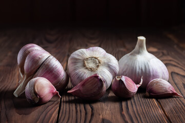 Garlic bulb on wooden background. Close up