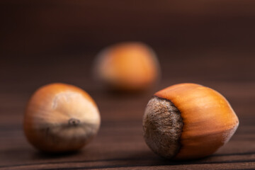 Hazelnut nut on wooden background close up