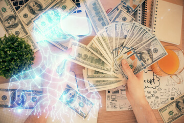 Multi exposure of vr glasses drawing hologram and USA dollars bills and man hands.