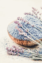 Essential lavender salt with flowers top view.