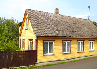 Fototapeta na wymiar View of street with old wooden house in Parnu Estonia