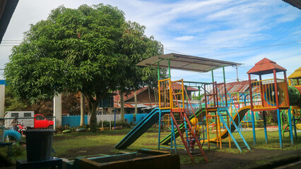 Tondano, Indonesia - October 10, 2022, children playing in the early childhood school playground