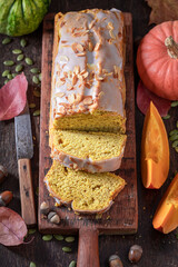 Aromatic halloween pie with almonds and white glaze.