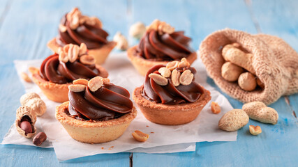 Homemade mini tartlets made of caramel and peanuts.