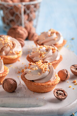Homemade mini tartlets made of cream and walnuts.