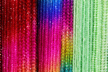 background of colorful necklaces made with beads for sale in the costume jewelry store