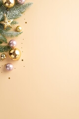 New Year decor concept. Top view vertical photo of fir branch in hoarfrost decorated with gold and pink baubles star ornaments and shiny confetti on isolated pastel beige background with empty space