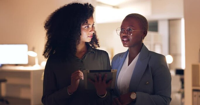 Black woman, research on tablet in office at night and employees working on digital corporate plan. Company marketing team, talking business strategy and collaborating for professional brand success