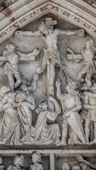 Crucifixion of Christ scene at major entrance portal of Saint Vitus Cathedral in Prague, Czech Republic, details, closeup