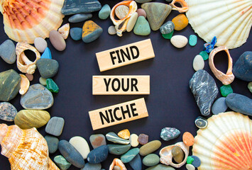 Find your niche symbol. Concept words Find your niche on wooden blocks. Sea stone, seashell....