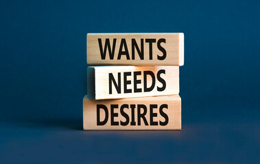 Wants needs and desires symbol. Concept words Wants Needs Desires on wooden blocks. Beautiful grey table grey background. Business, psychological wants needs and desires concept. Copy space.