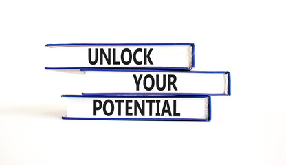 Unlock your potential symbol. Concept words Unlock your potential on books. Beautiful white table white background. Business, psychological and unlock your potential concept. Copy space.