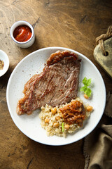 Beef steak with chickpea and vegetable sauce