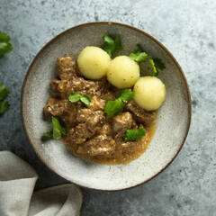 Homemade beef ragout with potato dumplings