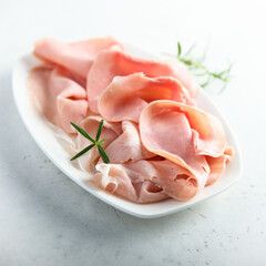 Traditional smoked ham on a white plate